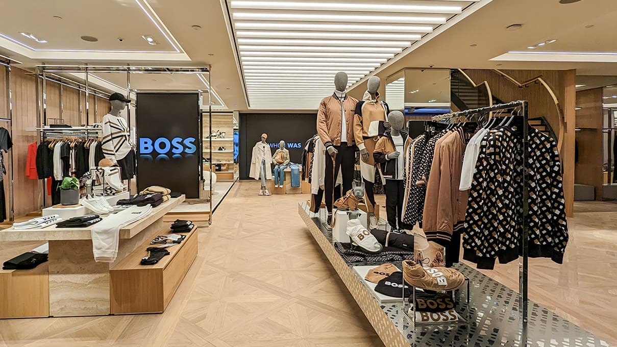 Remodeled HUGO BOSS store with shelfs of their newest collection on display (photo)