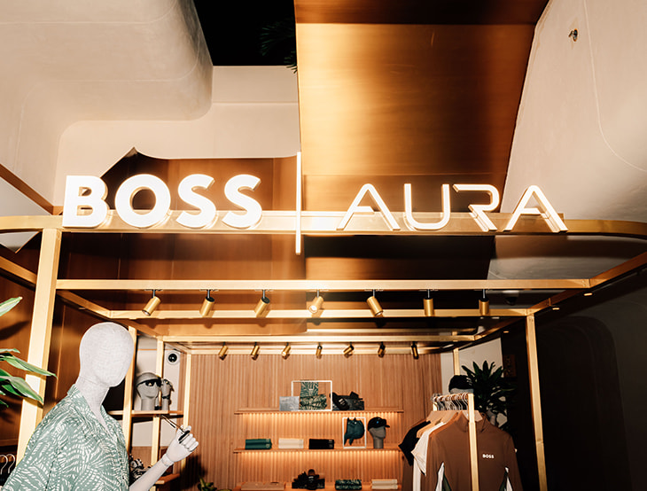 Male HUGO-BOSS products displayed on shelves at BOSS AURA, zoomed in (photo)
